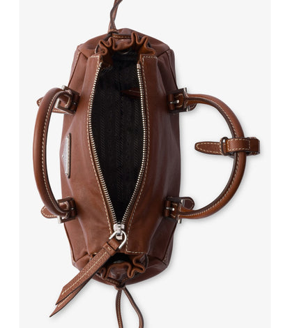 Prada Bonnie Small Leather Shoulder Bag in Brown, angle — The Quiet Edition