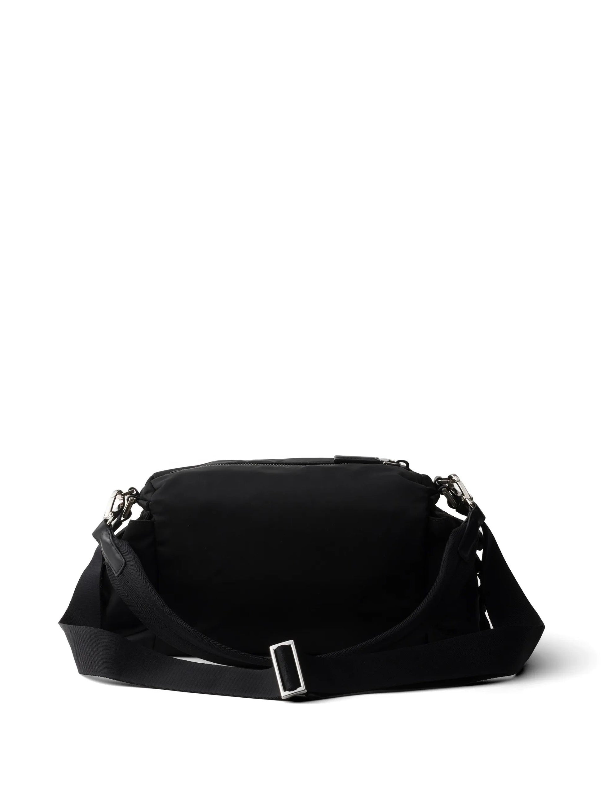 Prada Explore Re-Nylon hobo bag in black, back view with adjustable strap — The Quiet Edition