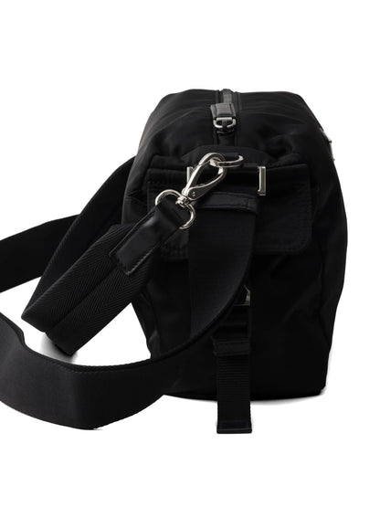 Prada Explore Re-Nylon hobo bag in black, side pocket detail — The Quiet Edition