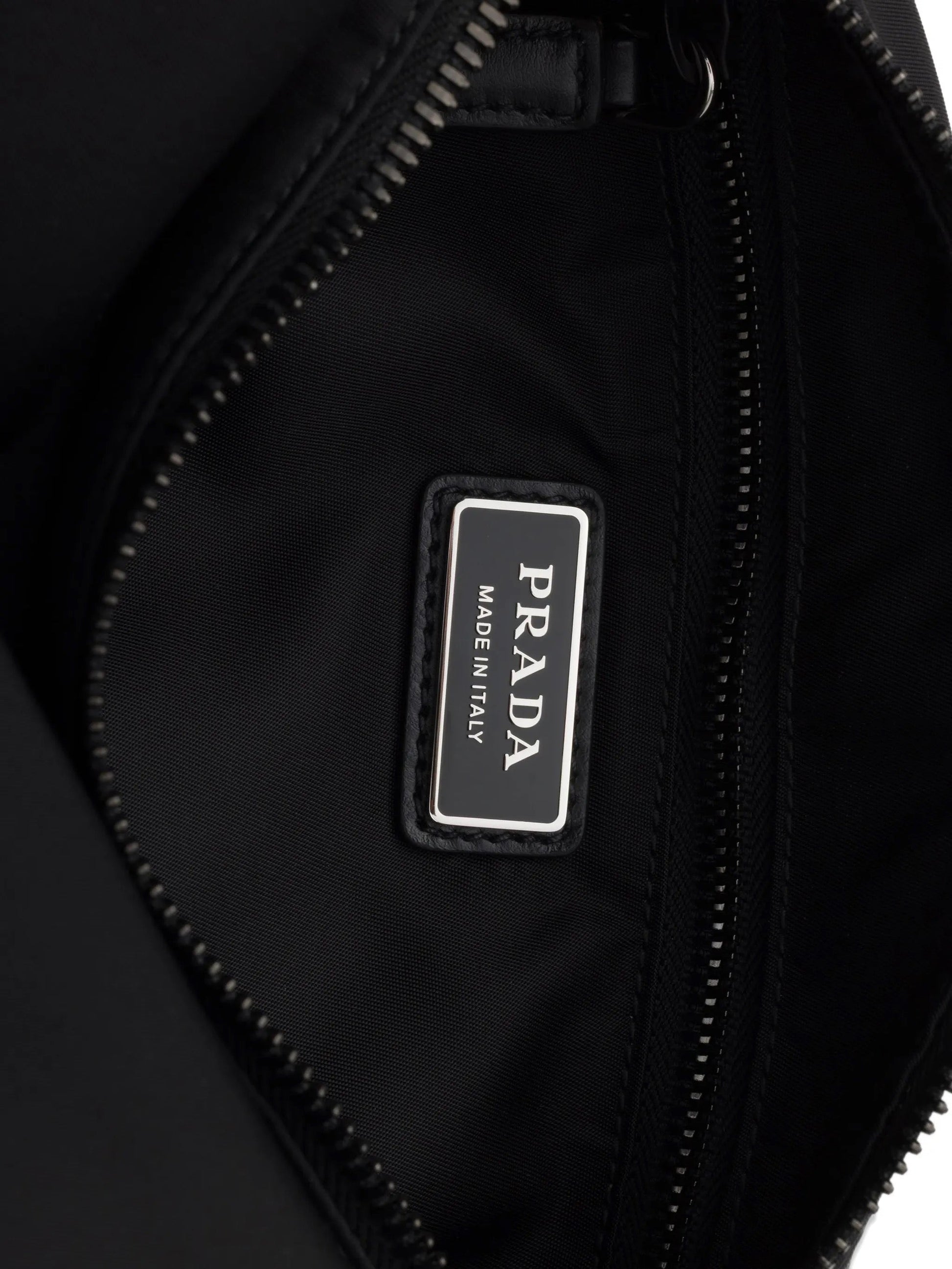 Prada Explore Re-Nylon hobo bag in black, interior Made in Italy label — The Quiet Edition