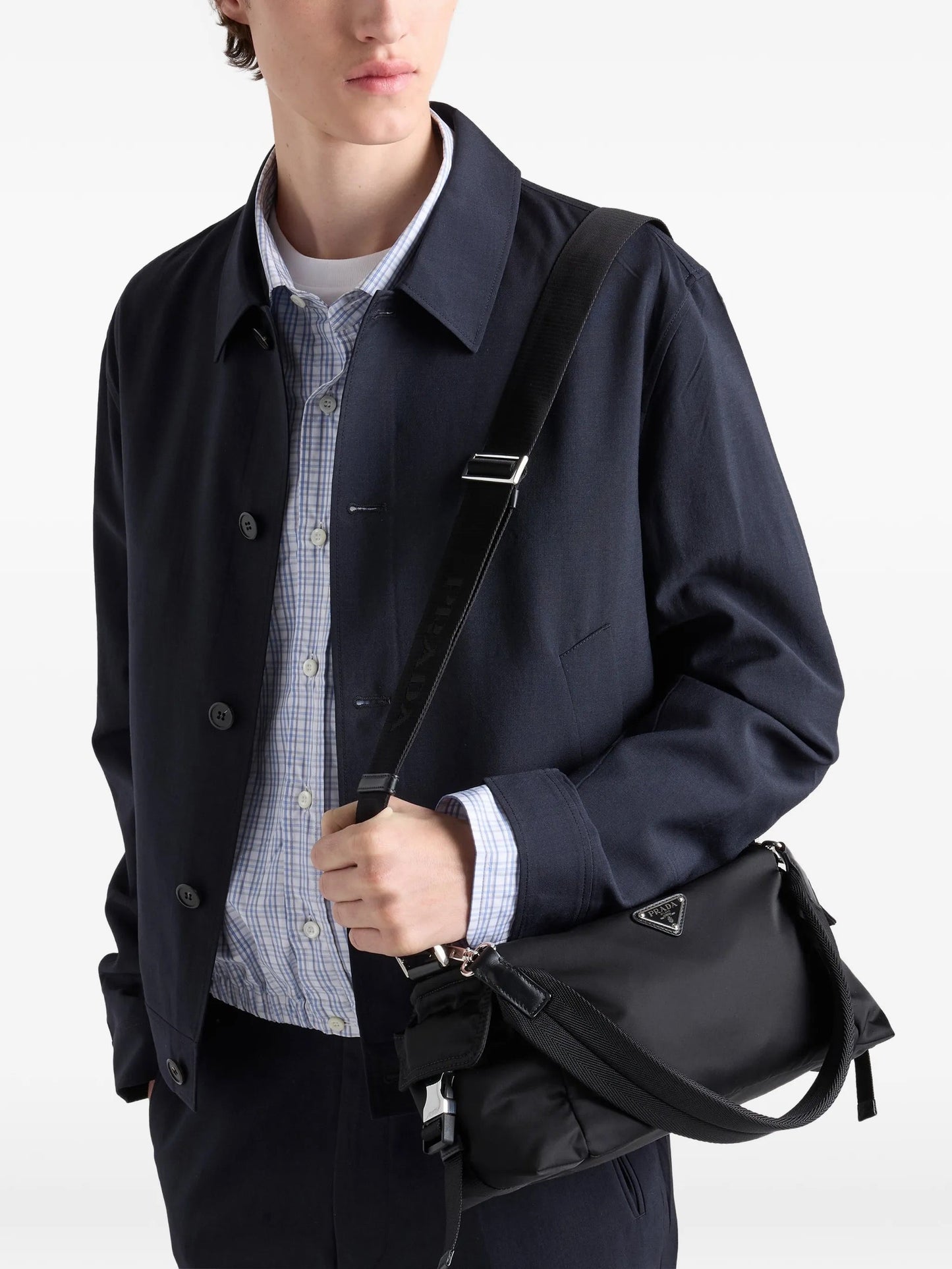 Prada Explore Re-Nylon hobo bag in black, model crossbody view — The Quiet Edition