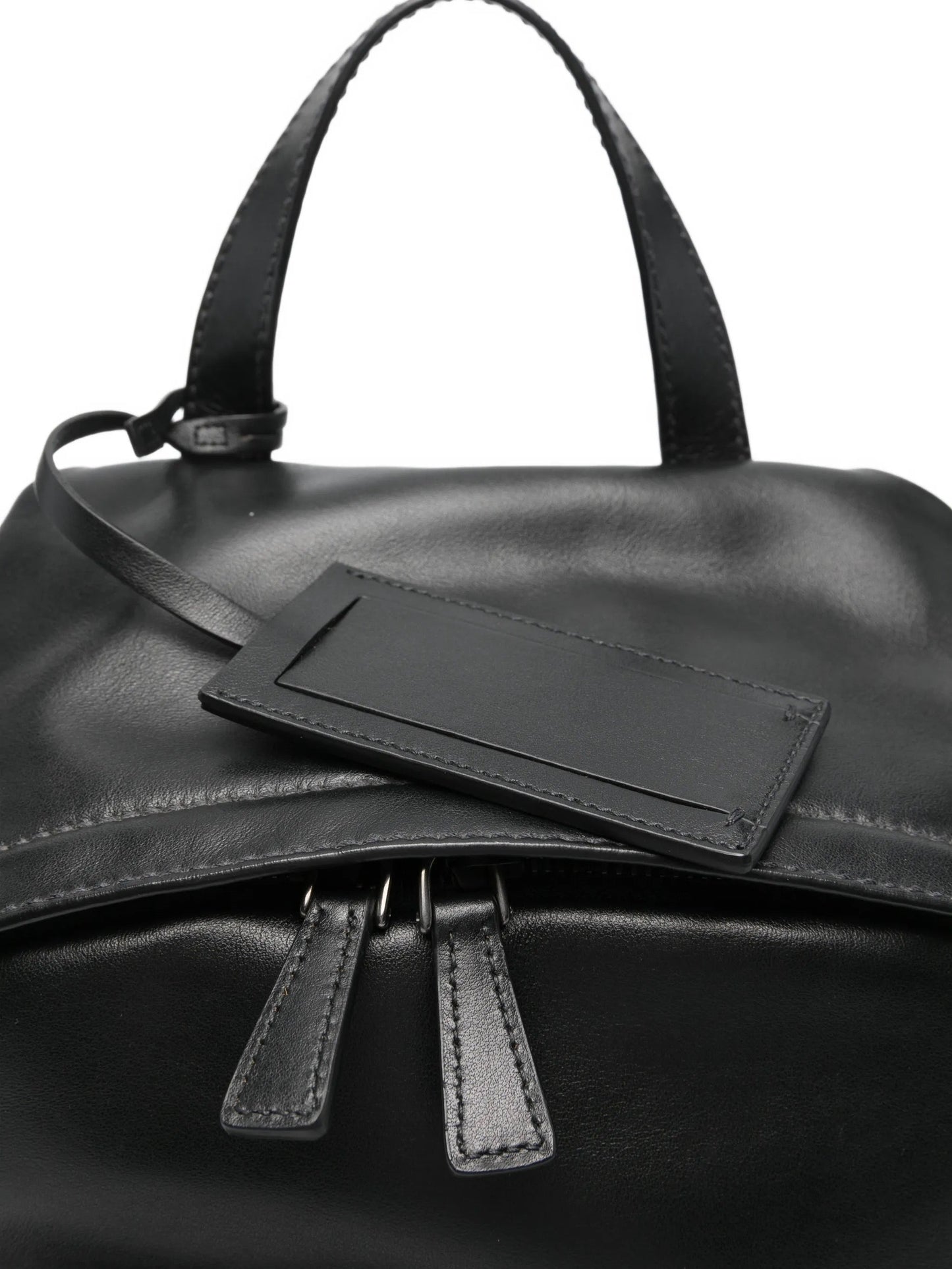 Prada leather backpack in black, top handle and pocket detail — The Quiet Edition