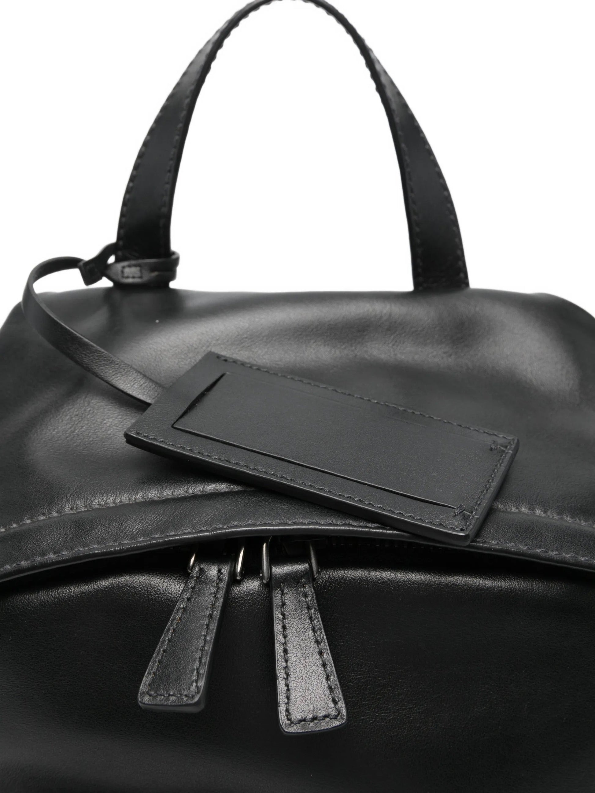 Prada leather backpack in black, top handle and pocket detail — The Quiet Edition
