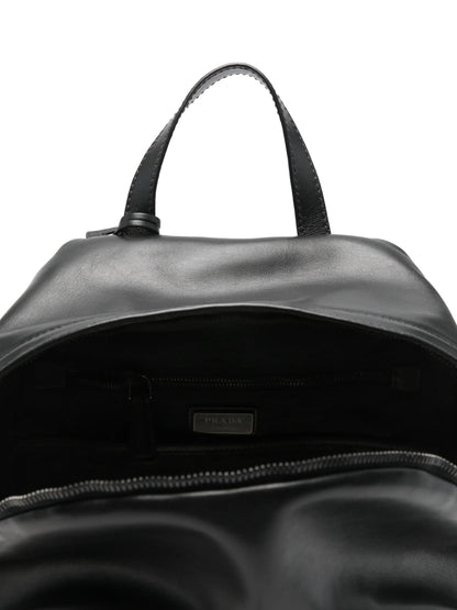 Prada leather backpack in black, interior with Prada Milano label — The Quiet Edition