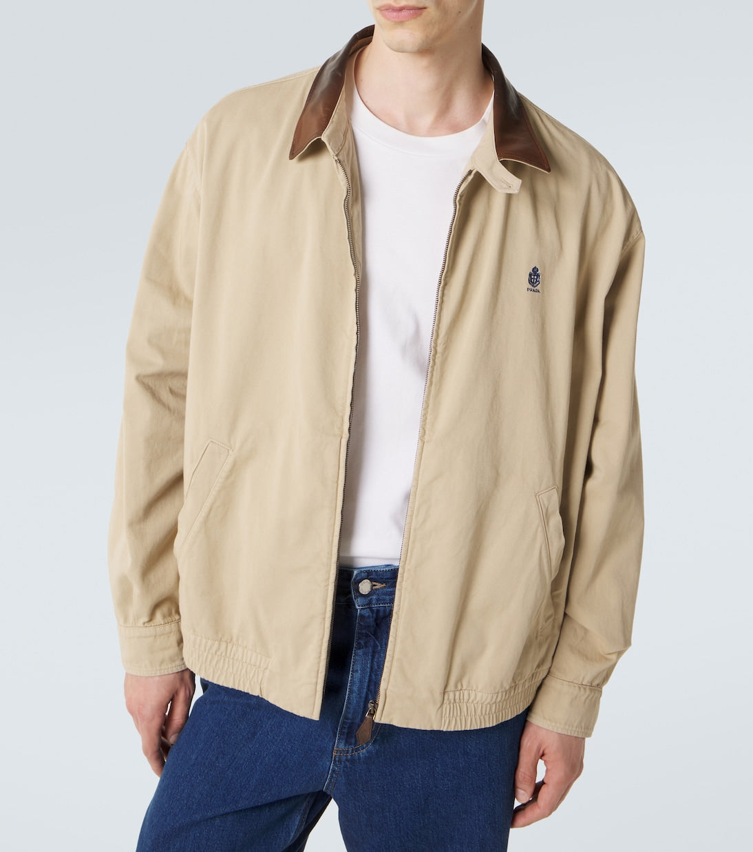 Prada Leather-Trimmed Cotton Blouson Jacket in beige, worn open, front view — The Quiet Edition