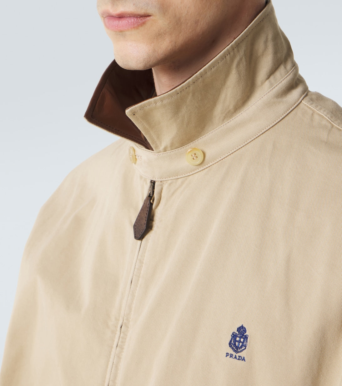 Prada Leather-Trimmed Cotton Blouson Jacket in beige, leather collar and logo detail — The Quiet Edition