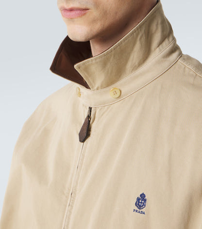Prada Leather-Trimmed Cotton Blouson Jacket in beige, leather collar and logo detail — The Quiet Edition