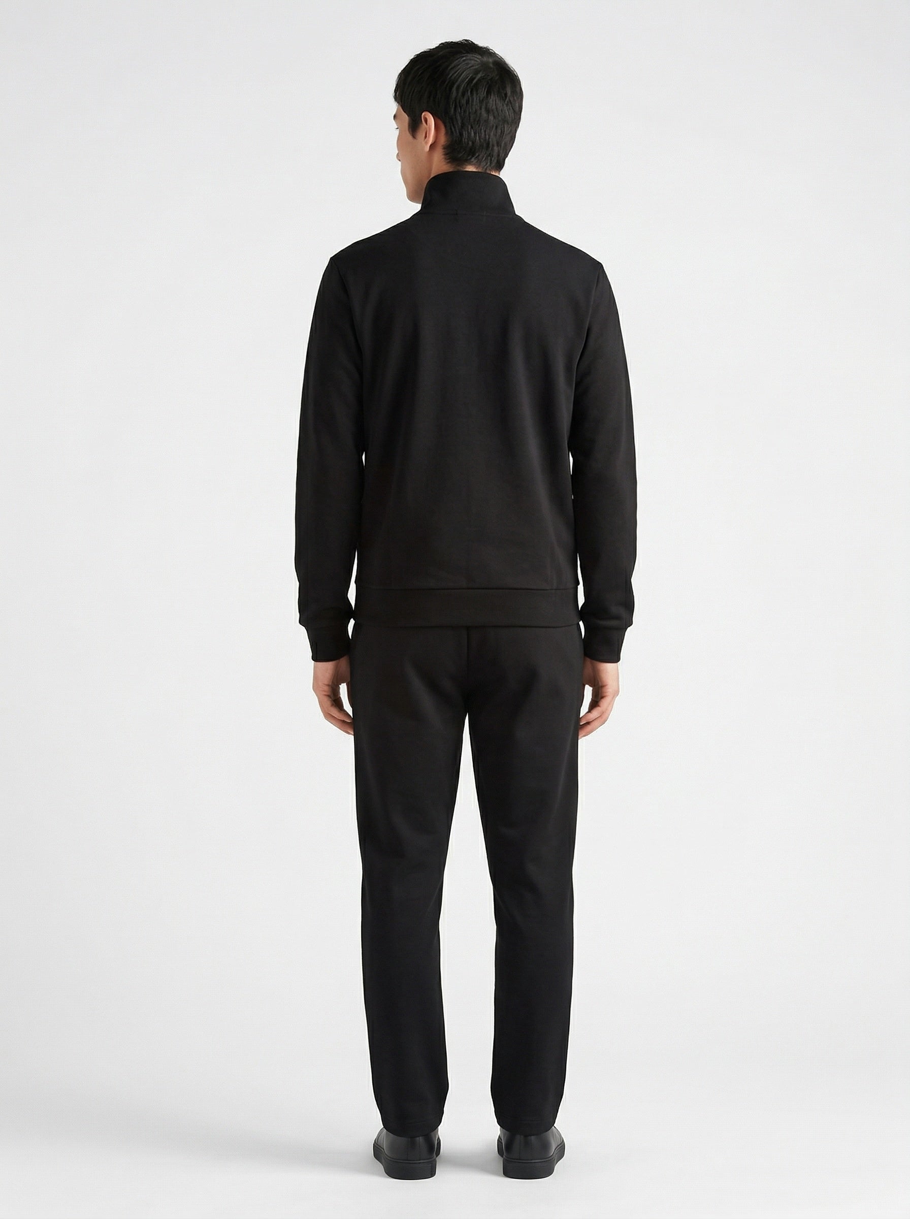 Prada logo patch zip cardigan in black, model back — The Quiet Edition