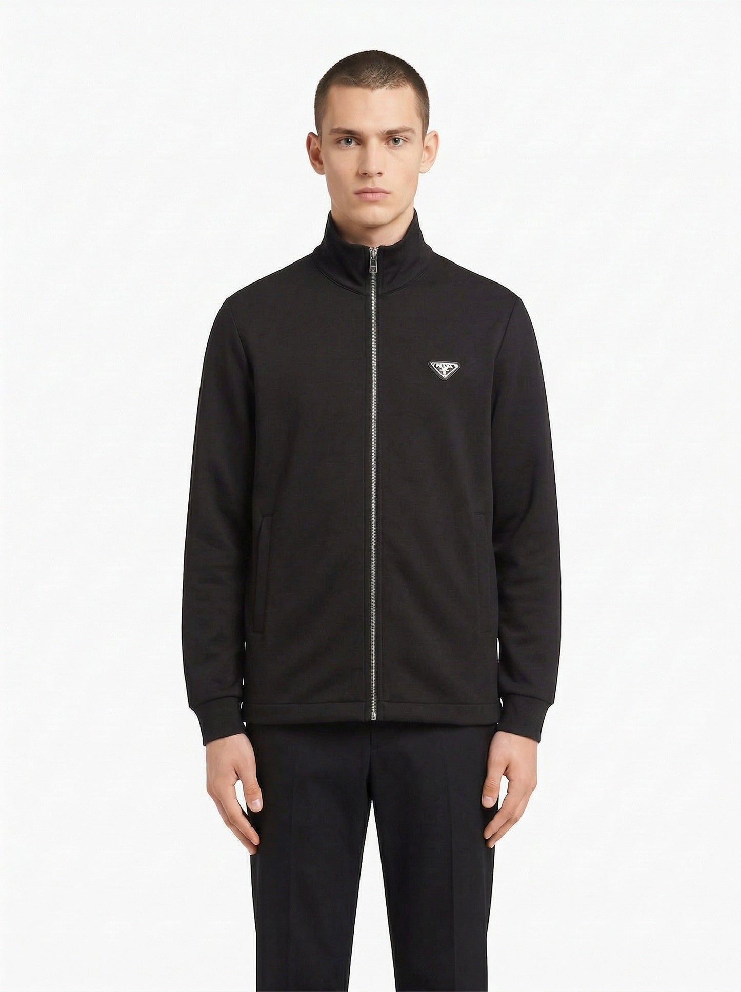 Prada logo patch zip cardigan in black, model front — The Quiet Edition