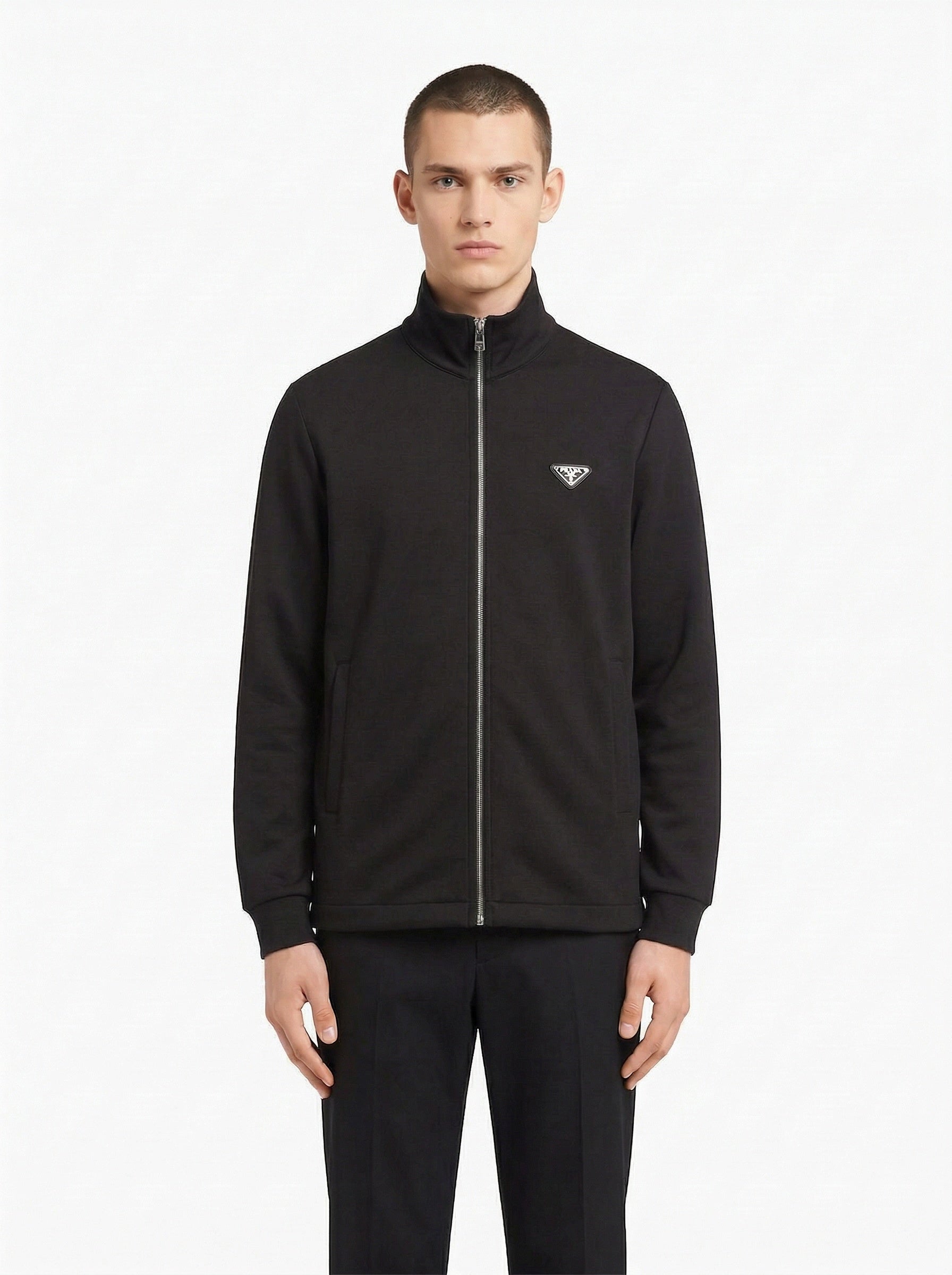 Prada logo patch zip cardigan in black, model front — The Quiet Edition