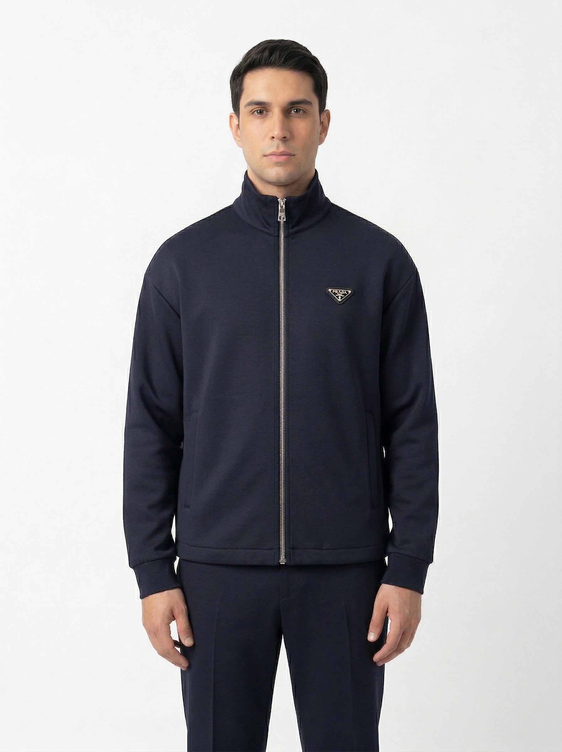 Prada logo patch zip cardigan in navy, model front — The Quiet Edition