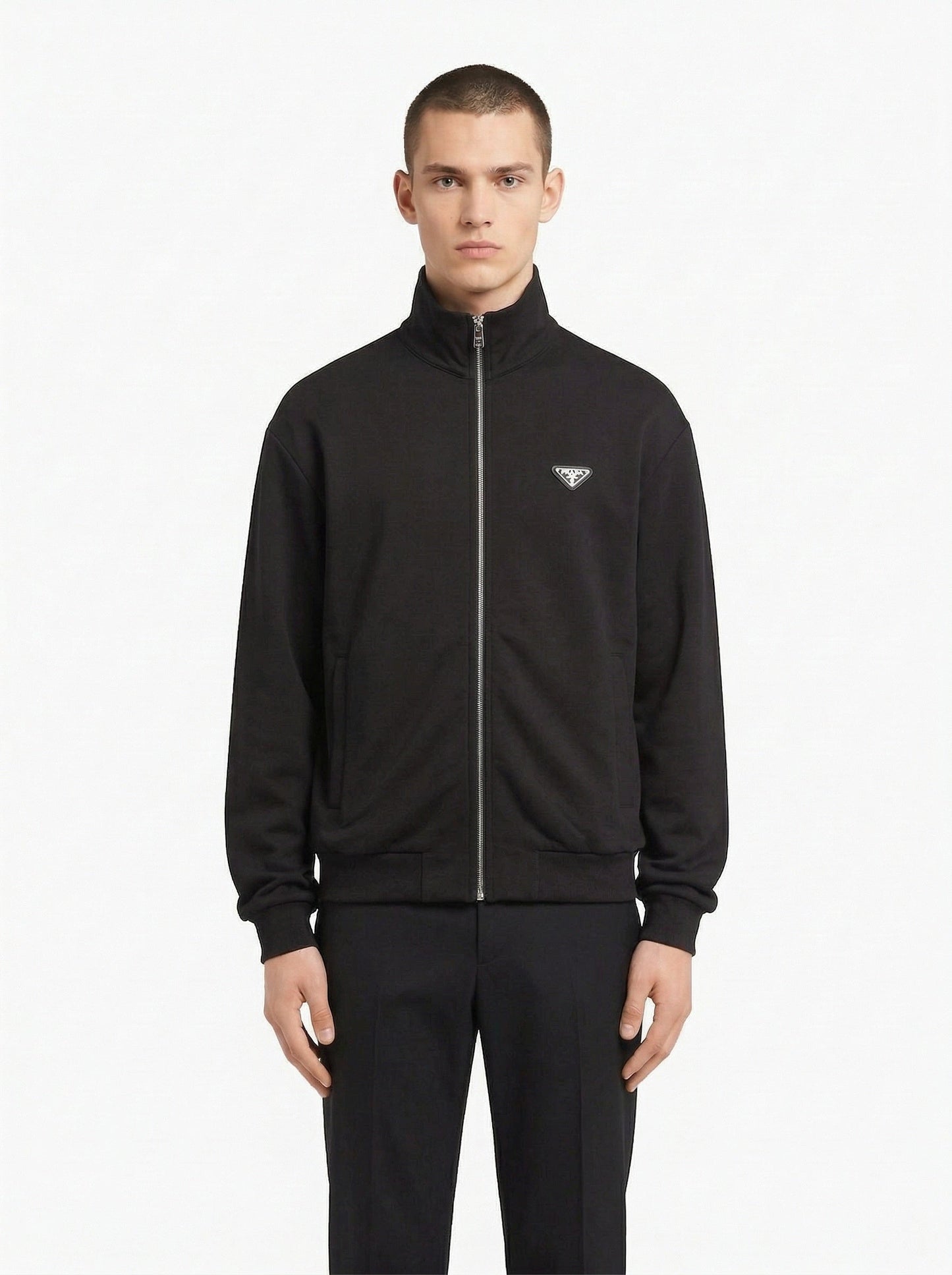 Prada logo patch zip cardigan in navy, model front — The Quiet Edition