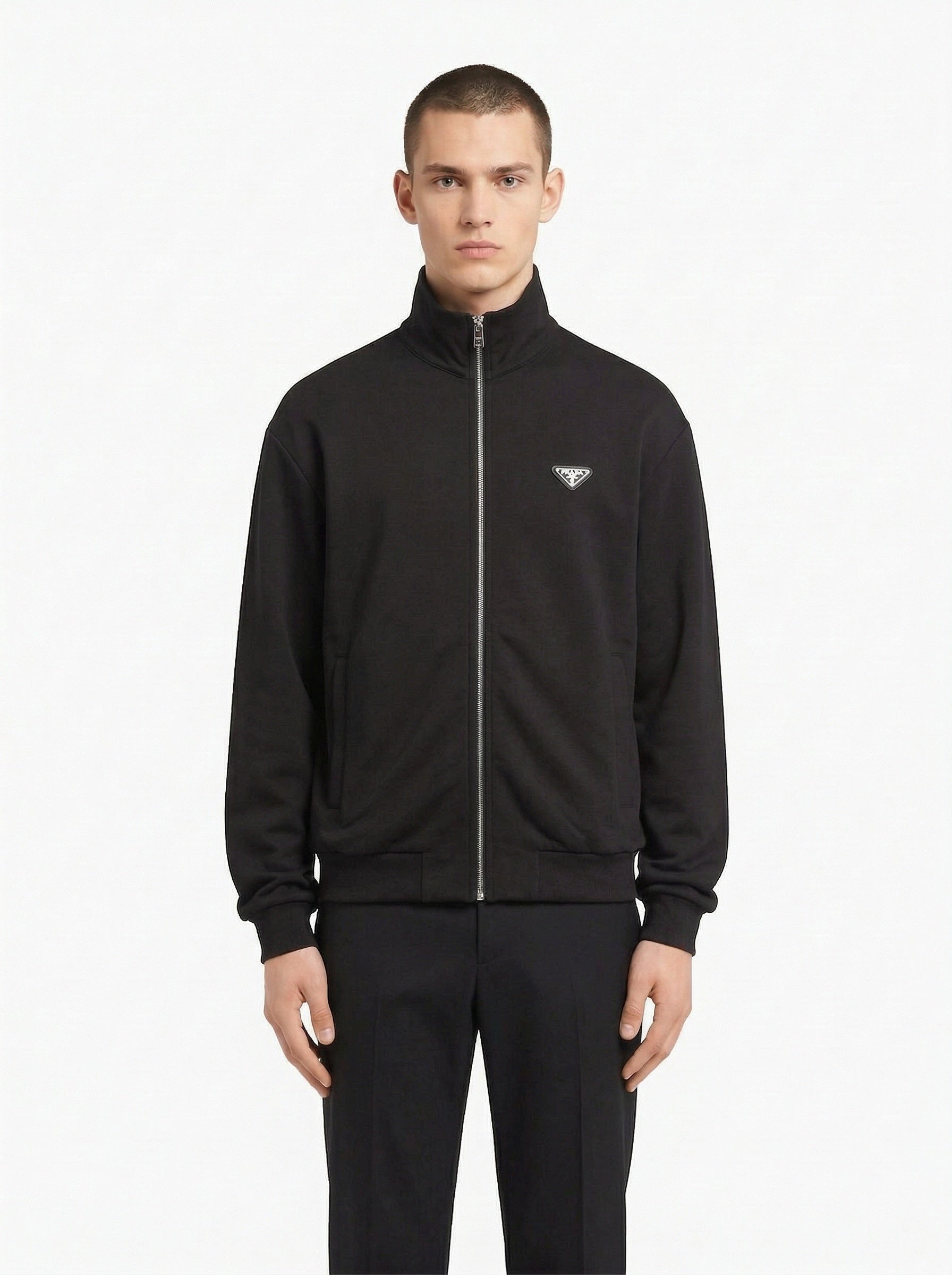 Prada logo patch zip cardigan in navy, model front — The Quiet Edition