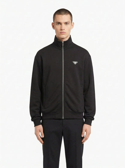 Prada logo patch zip cardigan in navy, model front — The Quiet Edition