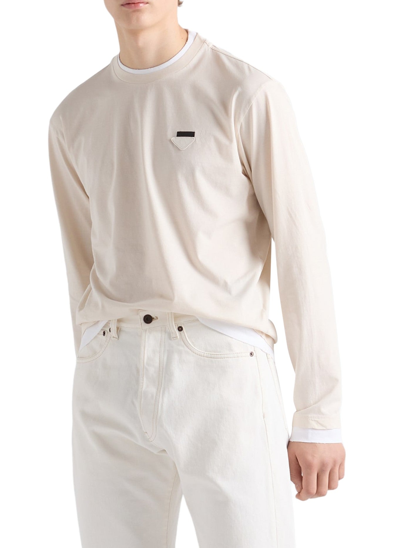 Prada Long-Sleeved Cotton T-Shirt in beige worn by a male model with white jeans, white cuffs showing