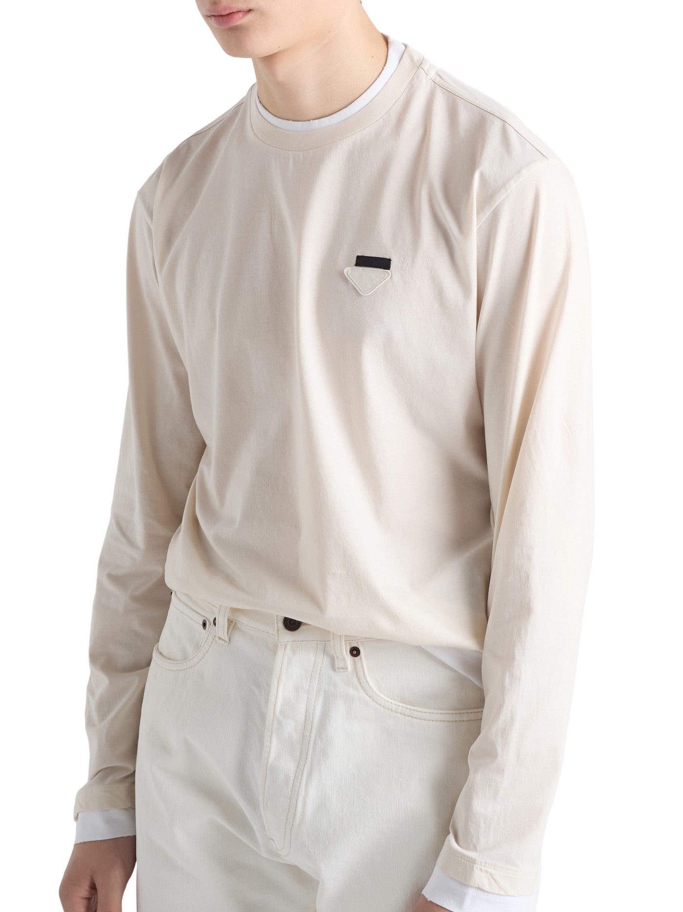 Prada Long-Sleeved Cotton T-Shirt in beige on a male model, angled front view with triangle logo