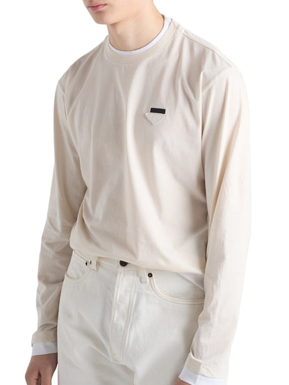 Prada Long-Sleeved Cotton T-Shirt in beige on a male model, angled front view with triangle logo