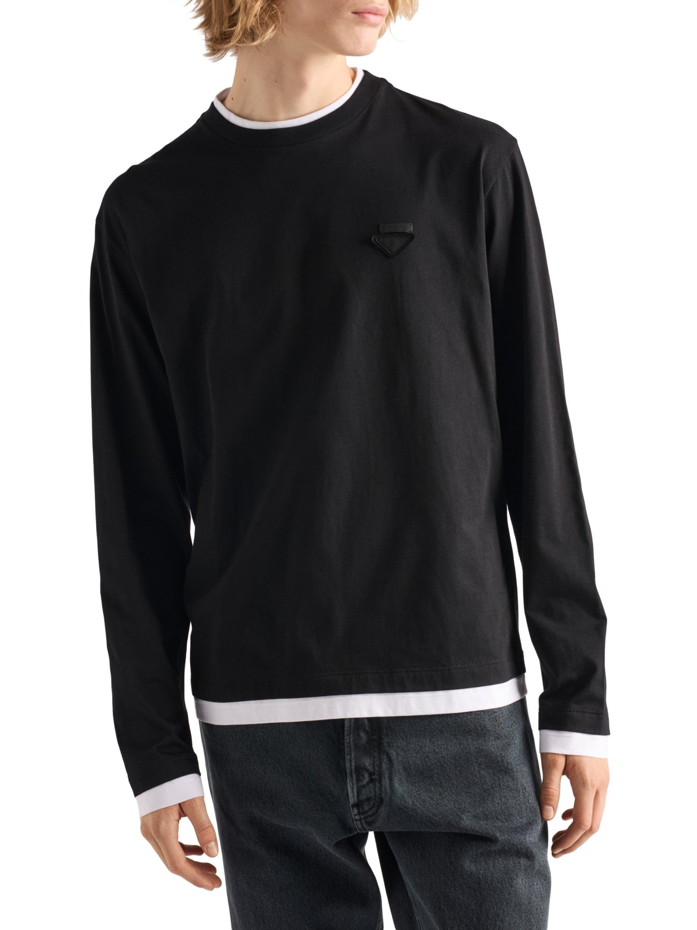 Prada Long-Sleeved Cotton T-Shirt in black on a male model, angled front view with white hem trim