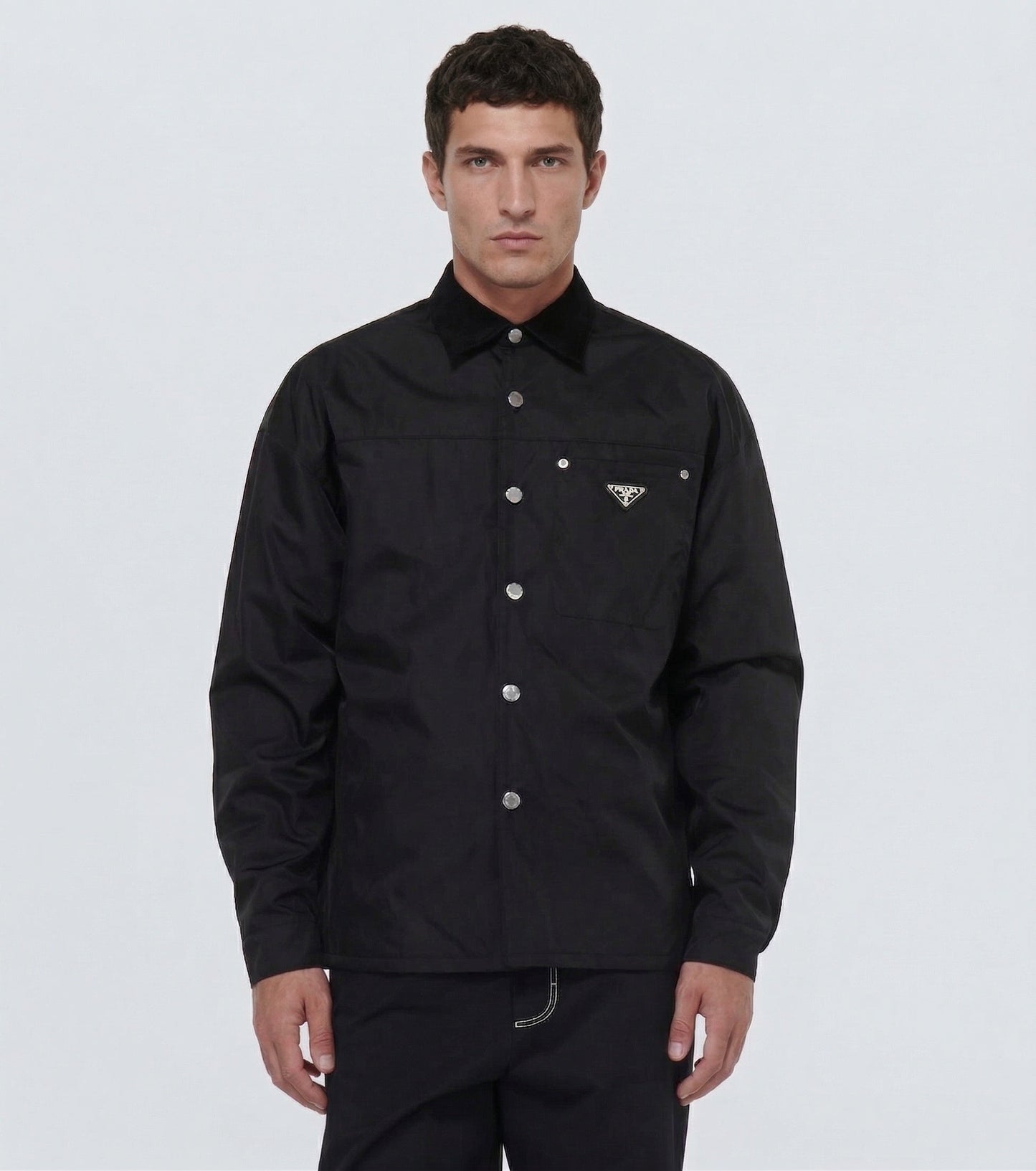 Prada Re-Nylon snap button overshirt in Black, model front — The Quiet Edition