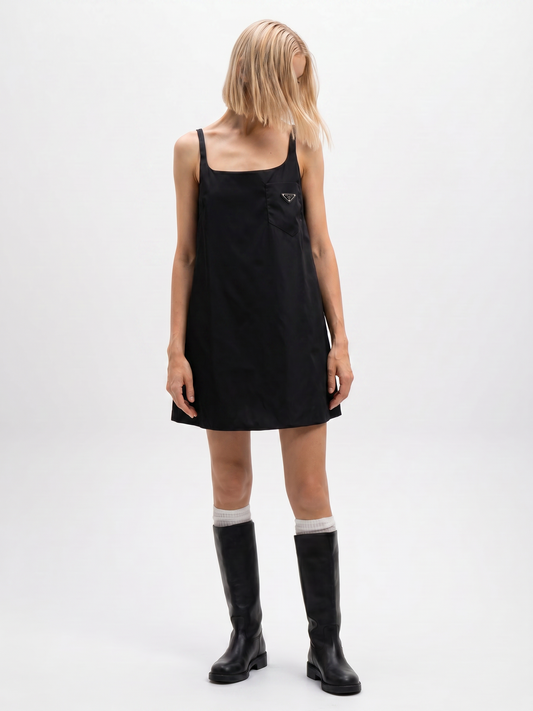 Prada Re-Nylon sleeveless dress in black, side view on model — The Quiet Edition