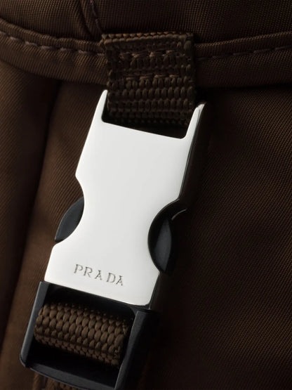 Prada Re-Nylon Backpack in Brown, angle — The Quiet Edition