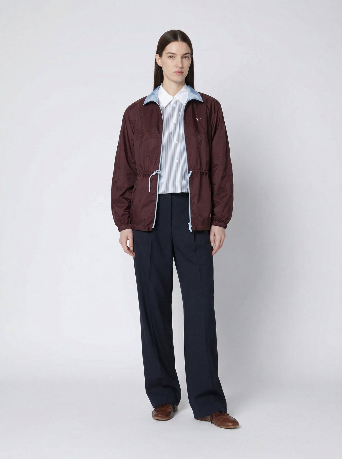 Prada Re-Nylon blouson jacket in burgundy, model front — The Quiet Edition