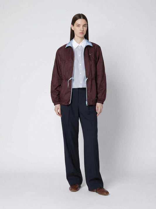 Prada Re-Nylon blouson jacket in burgundy, model front — The Quiet Edition