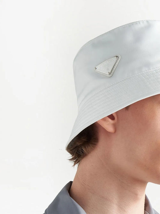 Prada Re-Nylon Bucket Hat in White, angle — The Quiet Edition