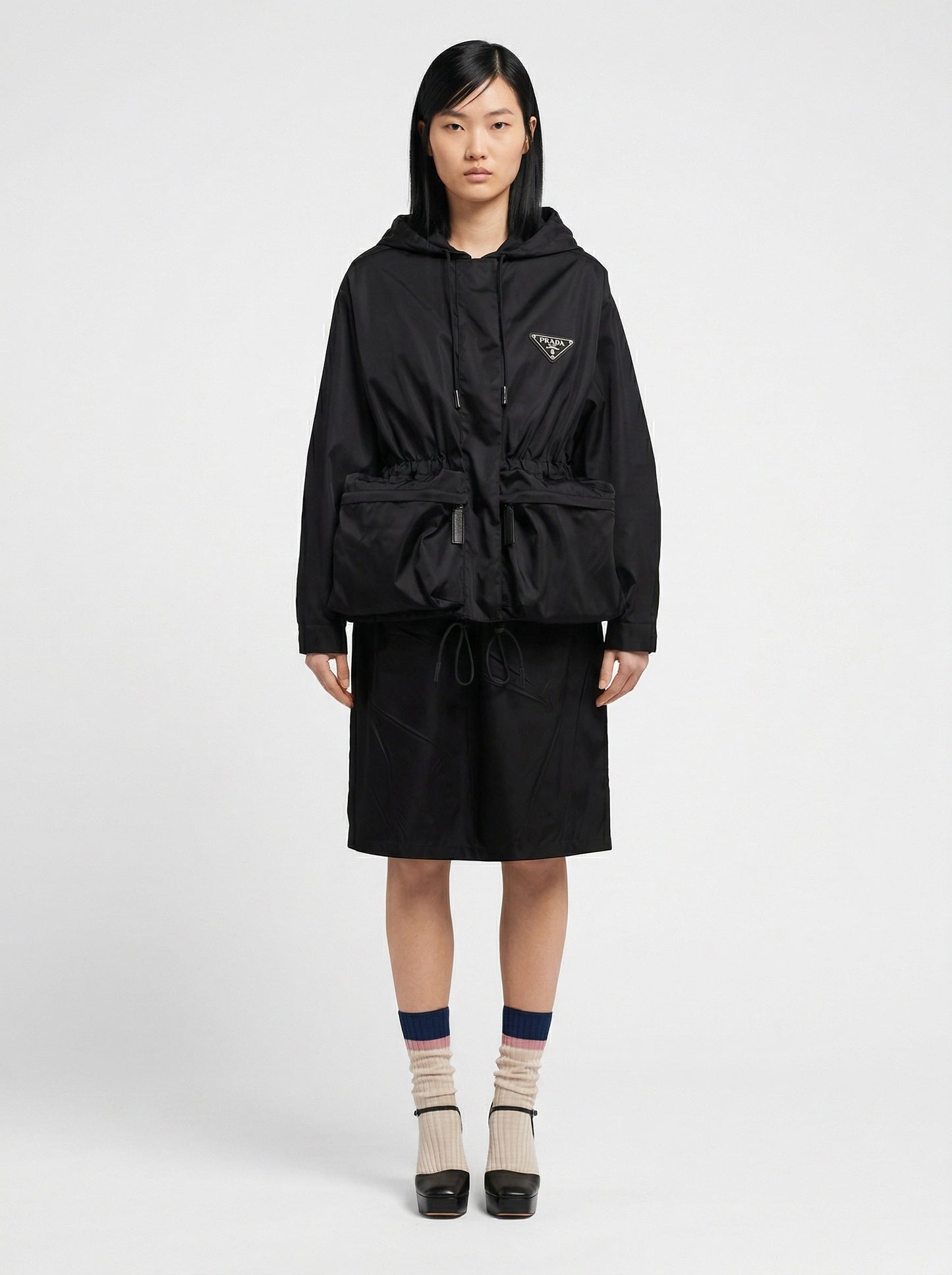Prada Re-Nylon hooded jacket in black, model front — The Quiet Edition