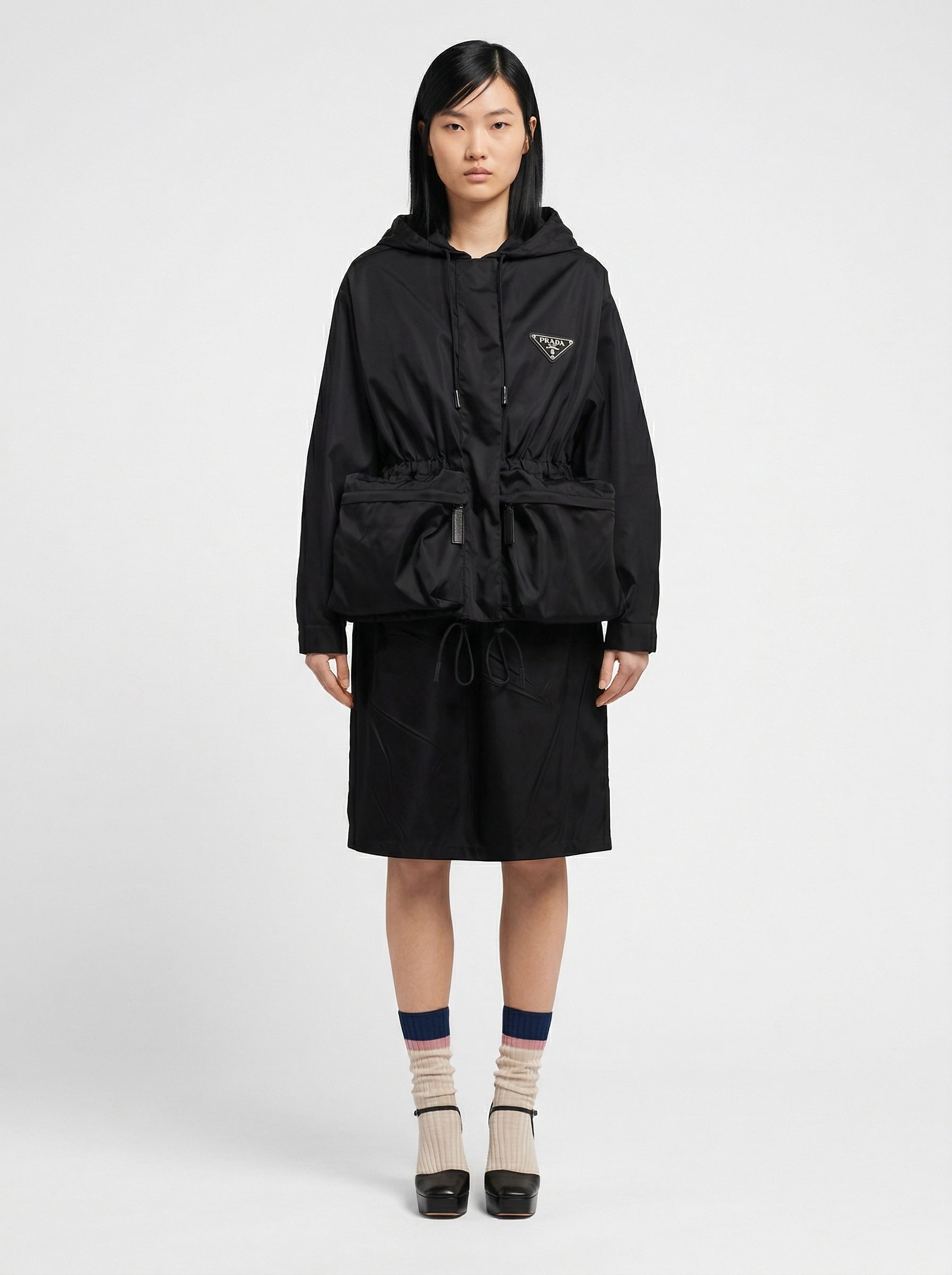 Prada Re-Nylon hooded jacket in black, model front — The Quiet Edition