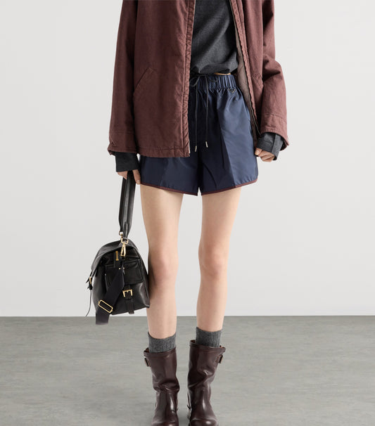 Prada Re-Nylon Shorts — Blue in Blue, angle — The Quiet Edition