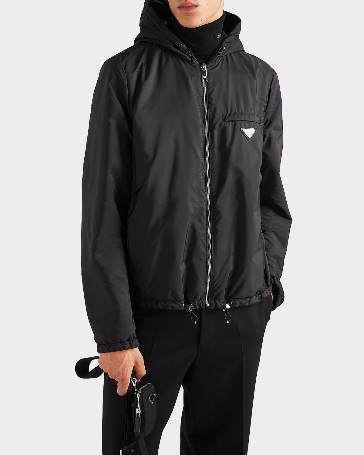 Prada reversible nappa leather and Re-Nylon jacket reversed to the Re-Nylon side, zipped, worn on model