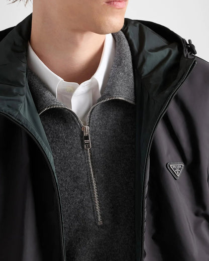 Prada Reversible Re-Nylon Jacket in green, worn view showing the black reverse side