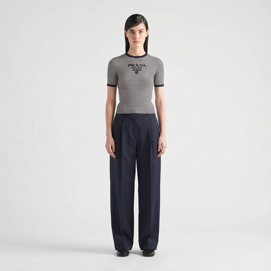 Prada silk cropped logo sweater in navy stripes, model front view — The Quiet Edition