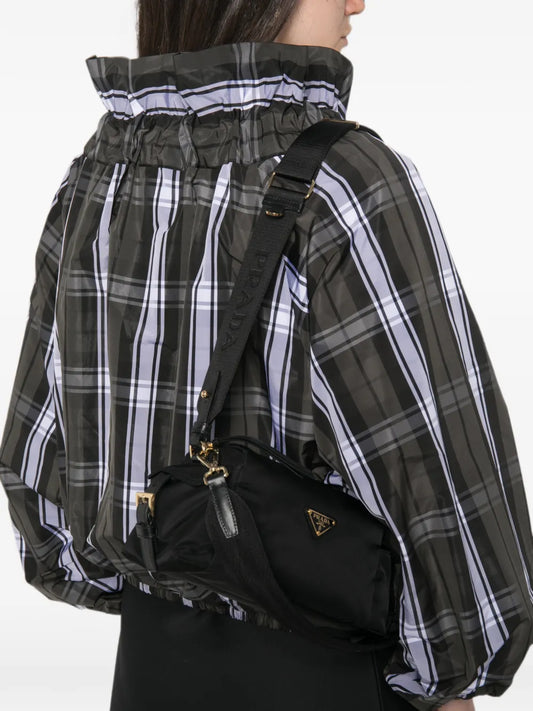 Prada Small Re-Nylon Shoulder Bag in black, worn crossbody — The Quiet Edition