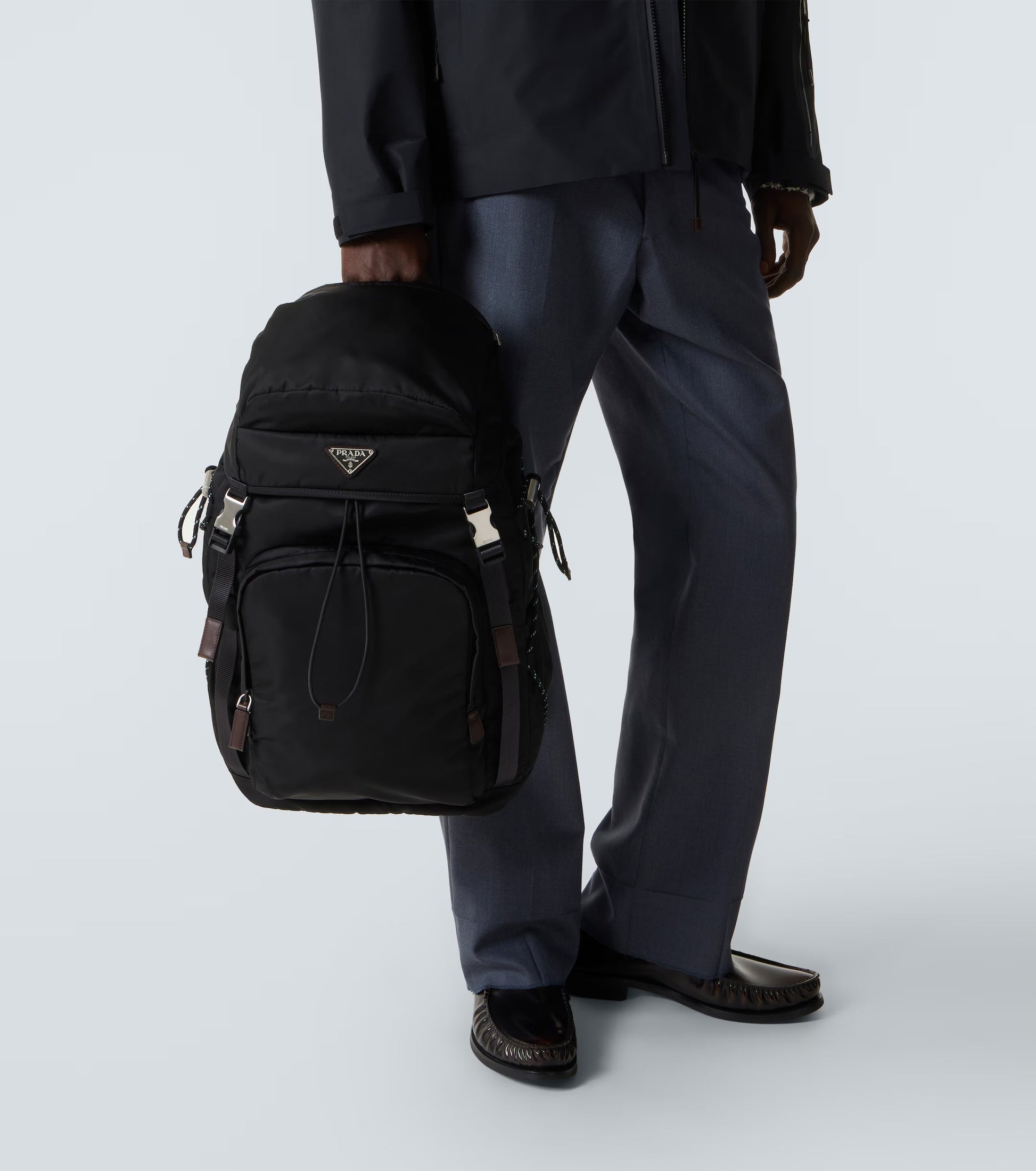 Prada Speedrock Re-Nylon backpack in black, model close-up — The Quiet Edition