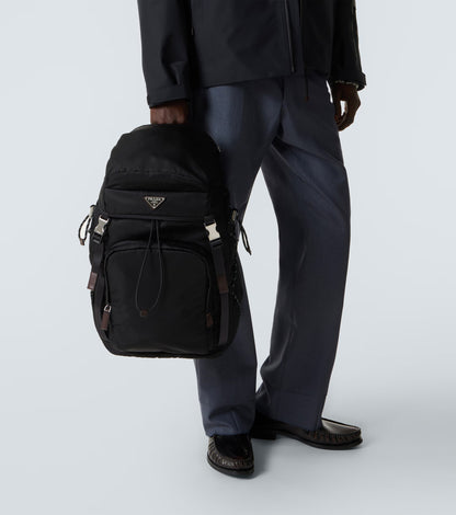 Prada Speedrock Re-Nylon backpack in black, model close-up — The Quiet Edition