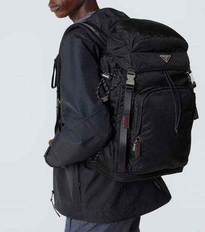 Prada Speedrock Re-Nylon backpack in black, model front view — The Quiet Edition