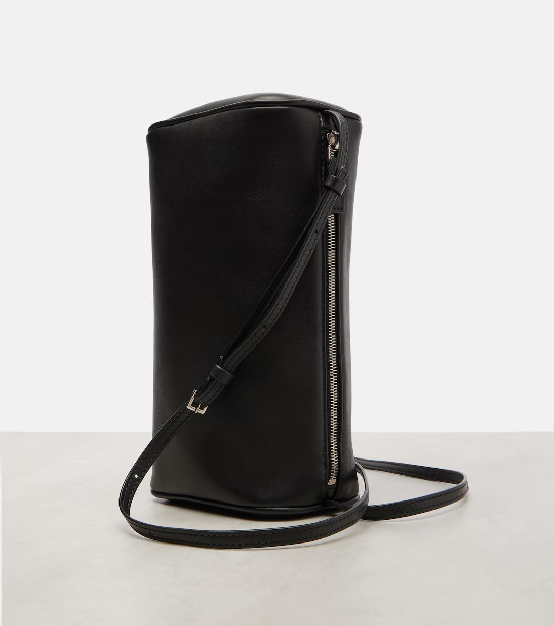 The Row '90s leather shoulder bag in black, upright angle view — The Quiet Edition