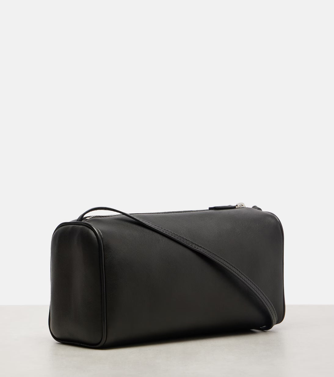 The Row '90s leather shoulder bag in black, side view — The Quiet Edition