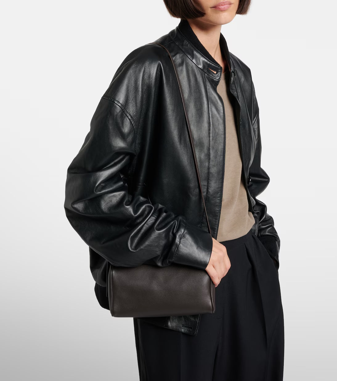The Row '90s leather shoulder bag in brown, model carrying view — The Quiet Edition
