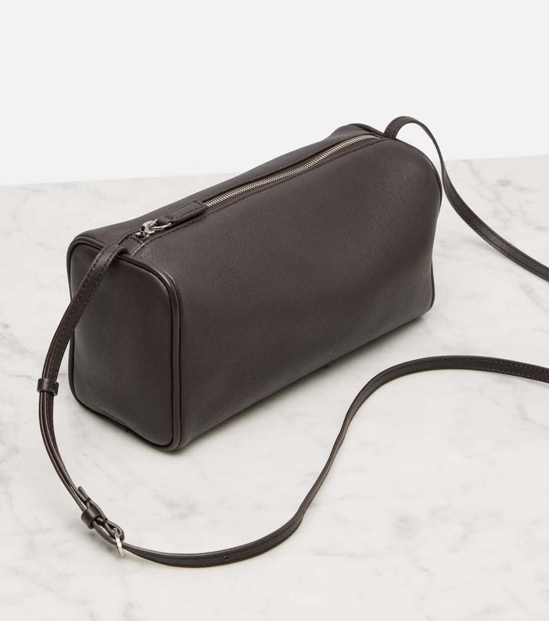 The Row '90s leather shoulder bag in brown, side view — The Quiet Edition