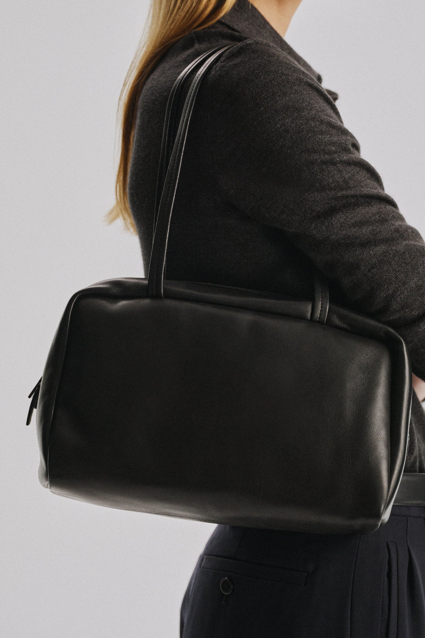The Row Astra Bowling Bag in Black, angle — The Quiet Edition