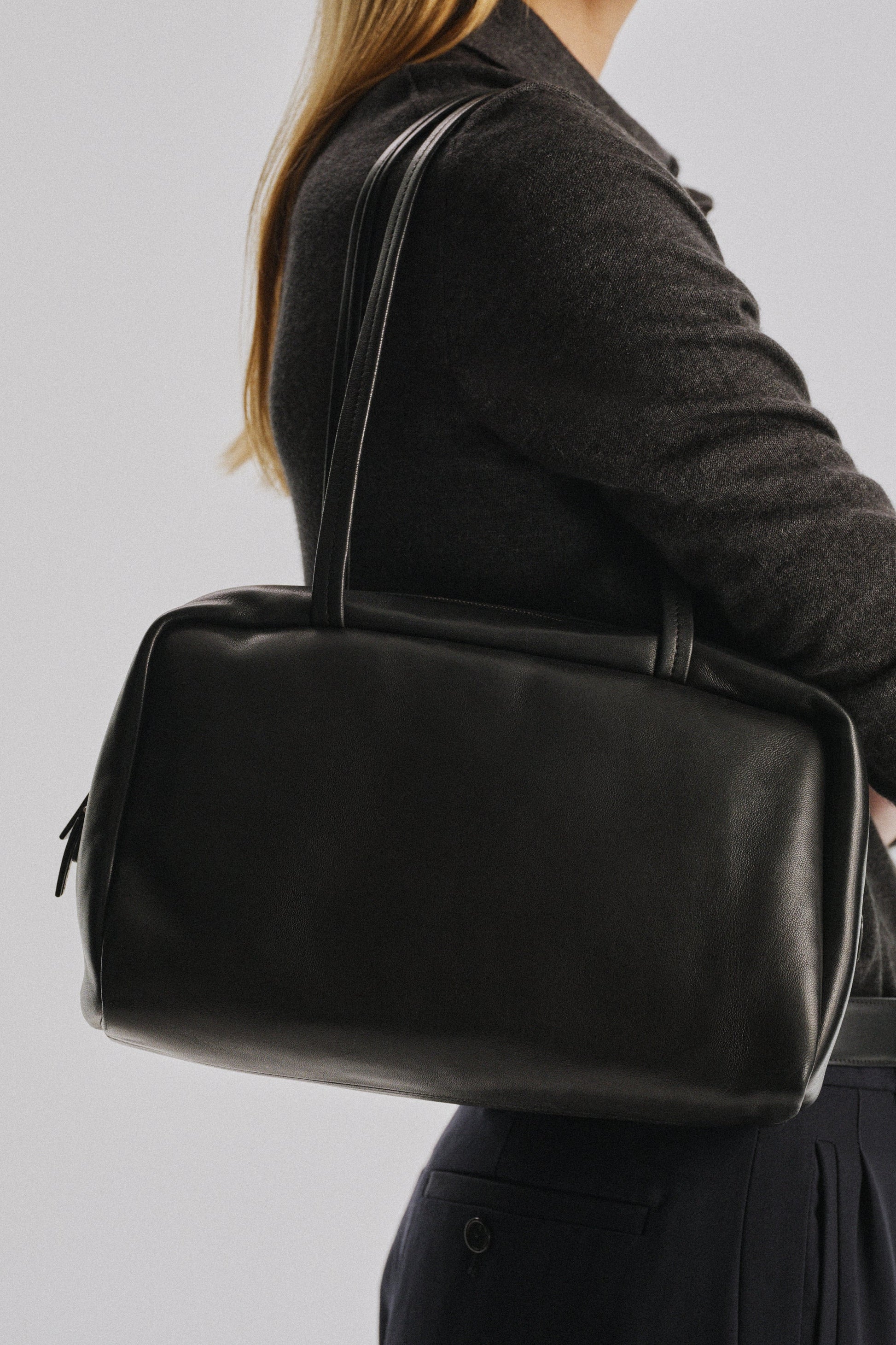 The Row Astra Bowling Bag in Black, angle — The Quiet Edition