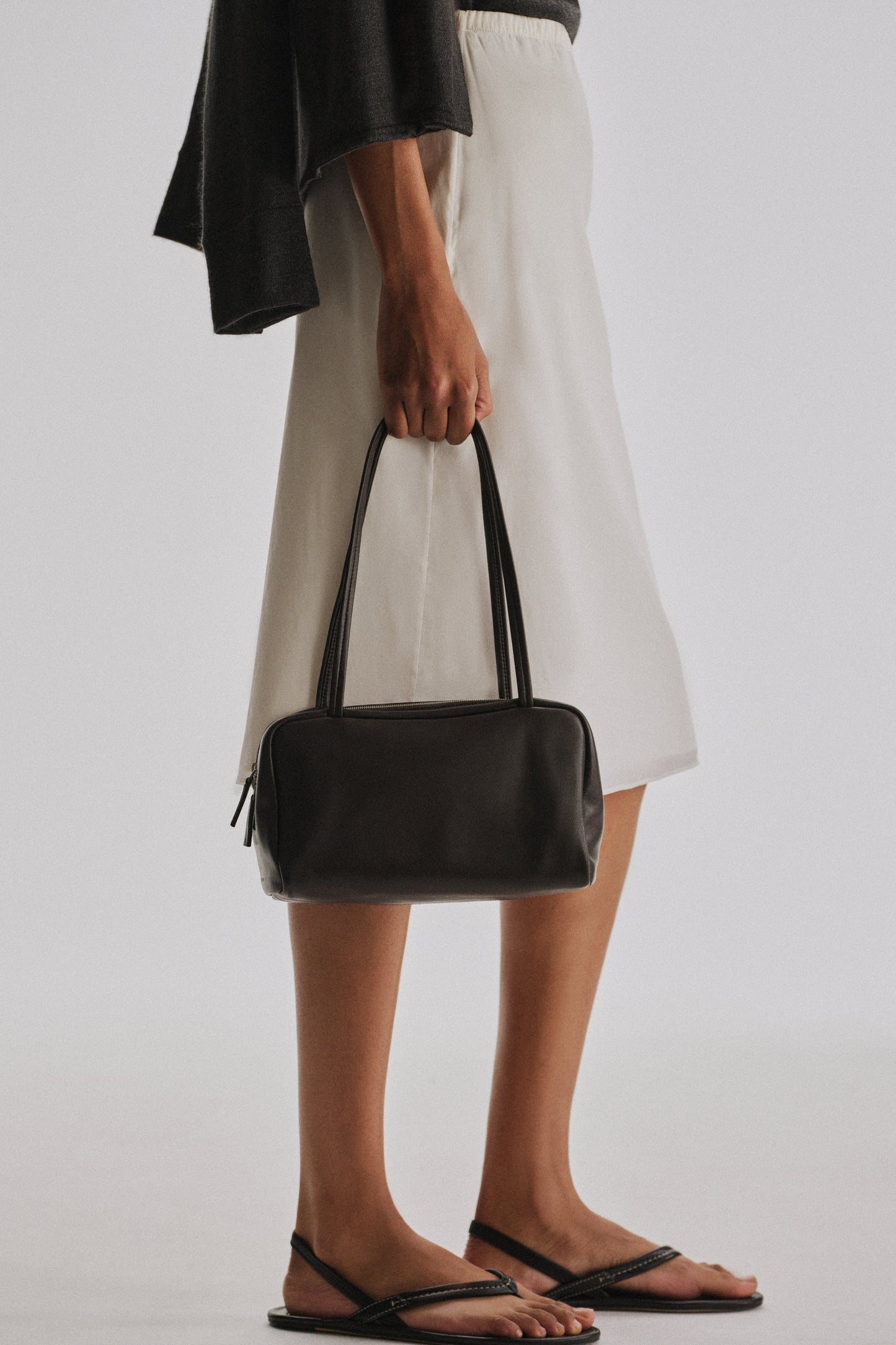 The Row Astra Bowling Bag in Dark Brown, angle — The Quiet Edition