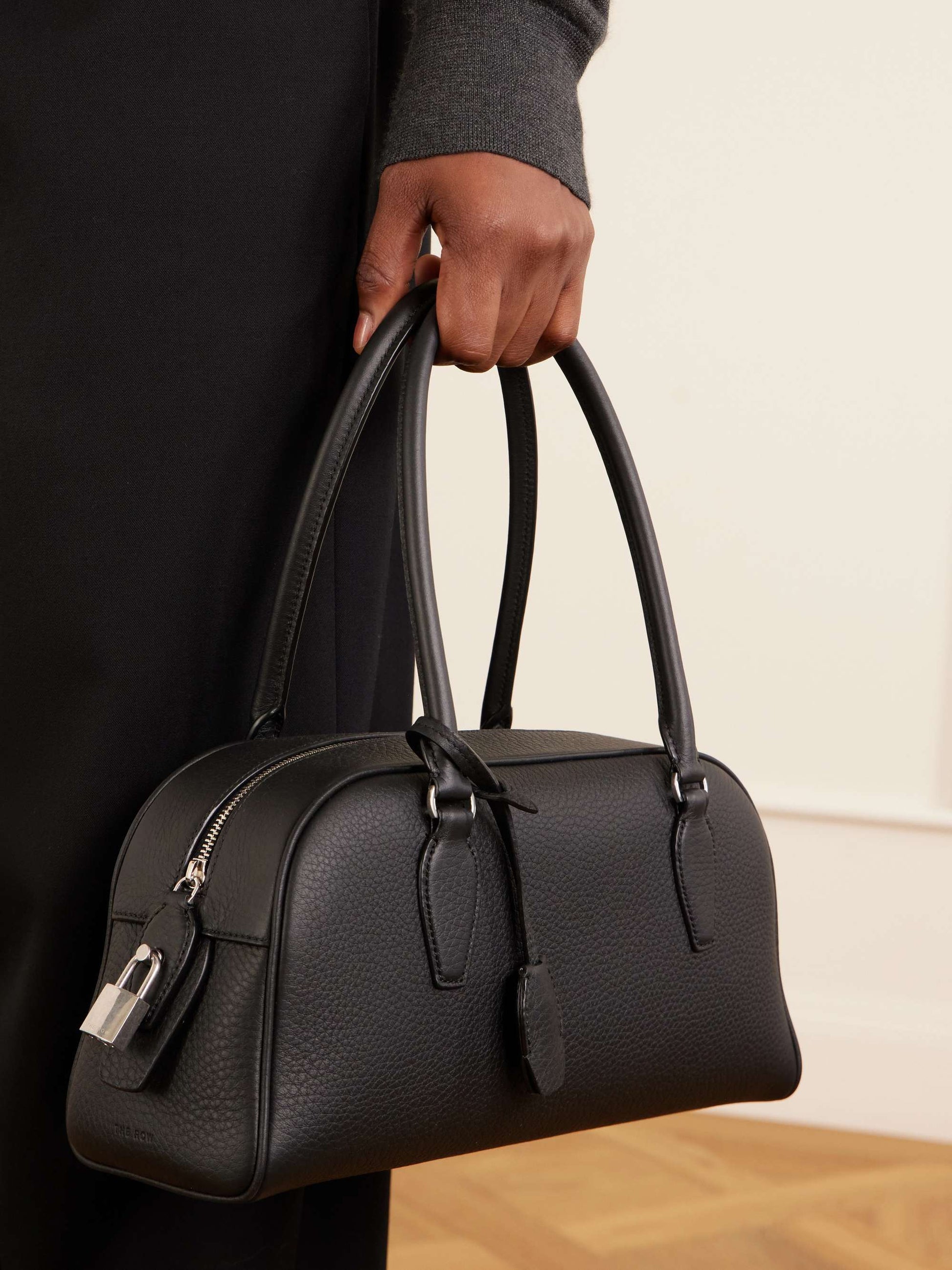 The Row Small E/W India Bag in Black, side view | The Quiet Edition