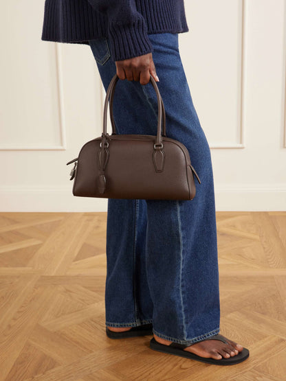 The Row Small E/W India Bag in Dark Brown, side view | The Quiet Edition