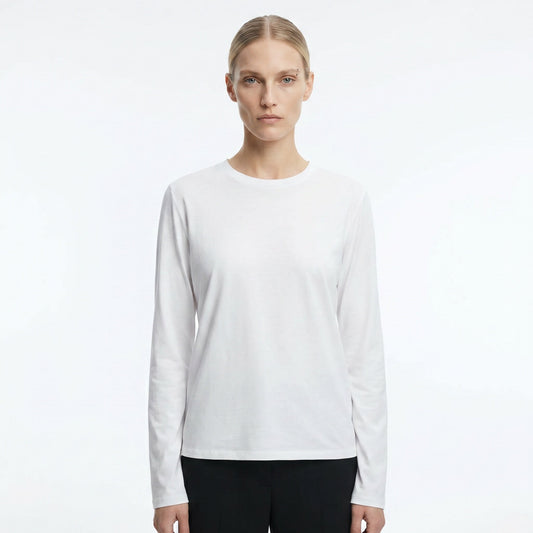 The Row Sherman long-sleeve t-shirt in white, front view on model — The Quiet Edition