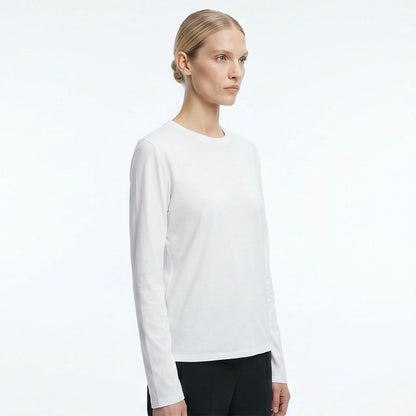The Row Sherman long-sleeve t-shirt in white, side angle on model — The Quiet Edition
