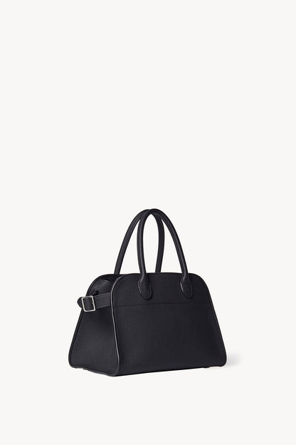 The Row Soft Margaux 10 Bag in Black, three-quarter angle view — The Quiet Edition